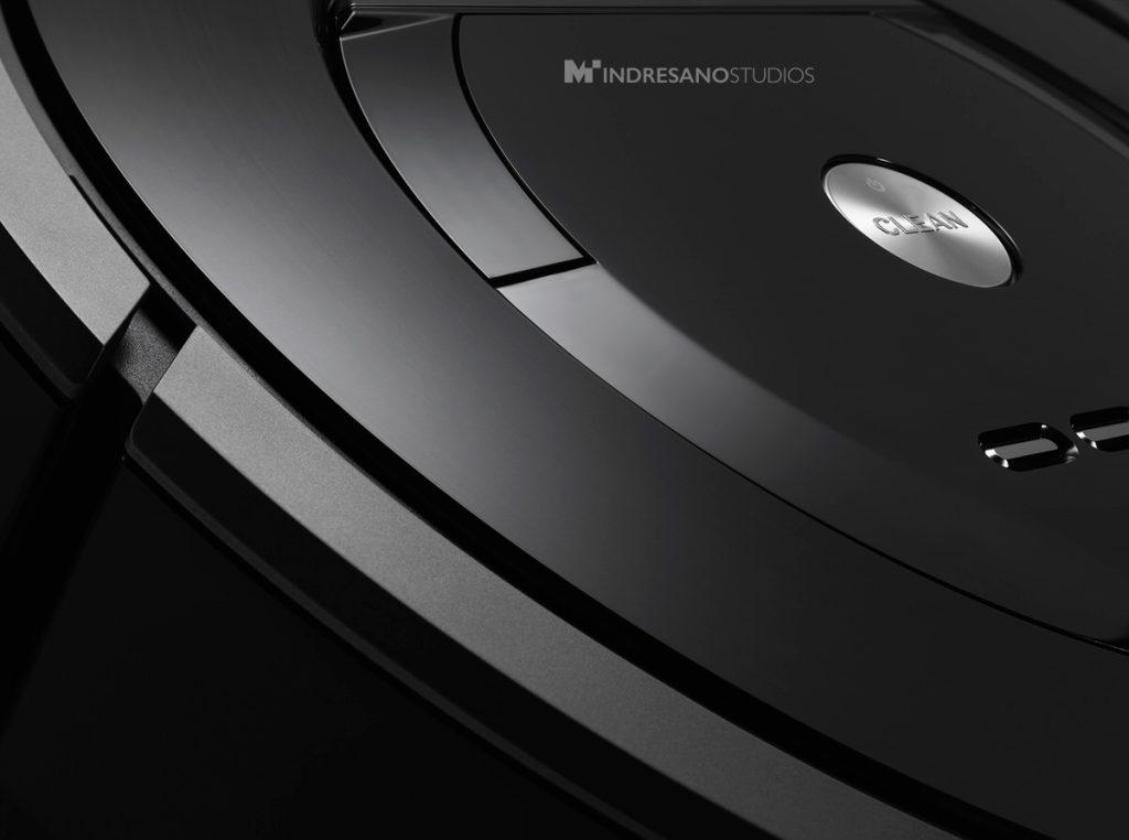 close-up of circular robot vacuum sensor and housing